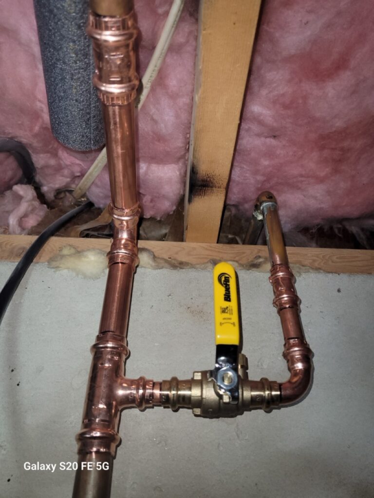 Home Corroded copper water lines and ball valve in a Gaithersburg basement – plumbing repair and repiping services.