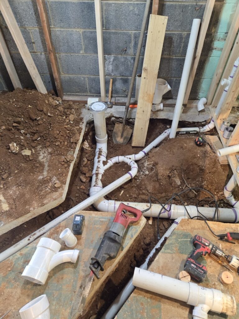 Gallery Plumbing installation and repairs in progress, showcasing Perfectum Construction & Plumbing's remodeling work.