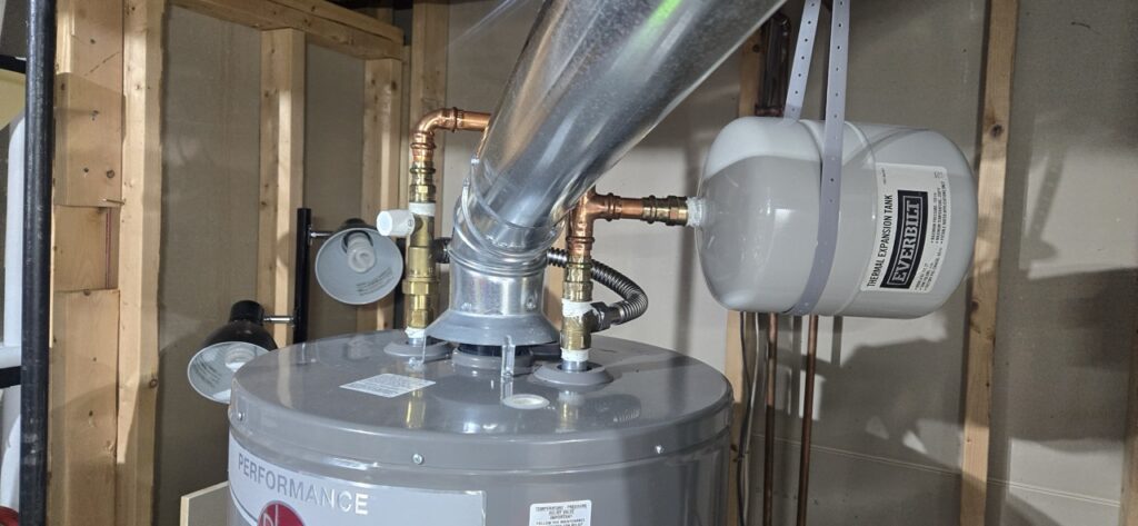 Gallery Plumbing and HVAC installation by Perfectum Construction & Plumbing: water heater and expansion tank.