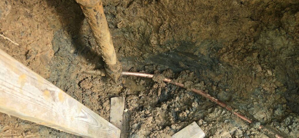 Gallery Copper pipes installed in trench during Perfectum Plumbing restoration project