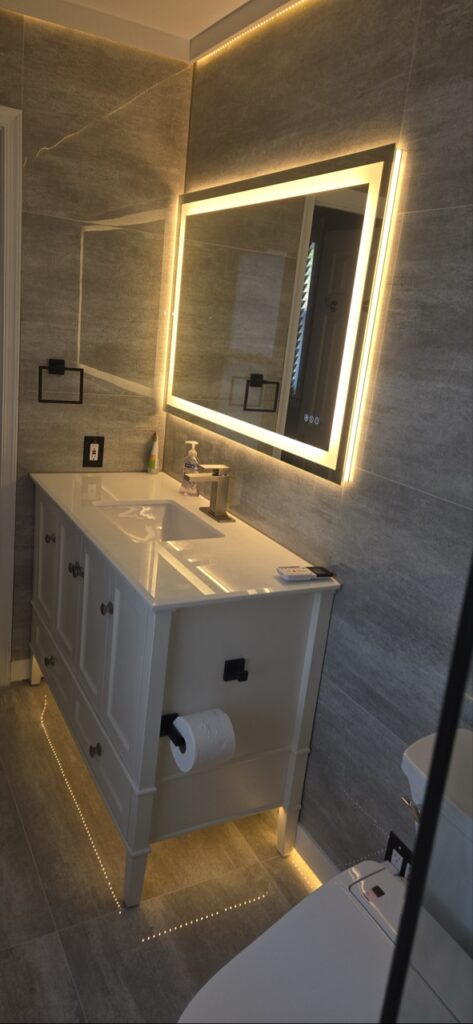 Gallery Bathroom remodel with vanity and lighted mirror by Perfectum Construction & Plumbing.