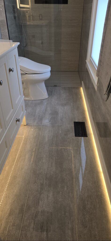 Gallery Completed bathroom remodel with tile shower and vanity by Perfectum Construction & Plumbing.