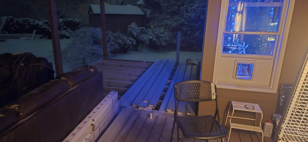 Gallery House remodeling and restoration project by Perfectum Construction & Plumbing in Gaithersburg, MD, showing exterior construction and a snow-covered yard.
