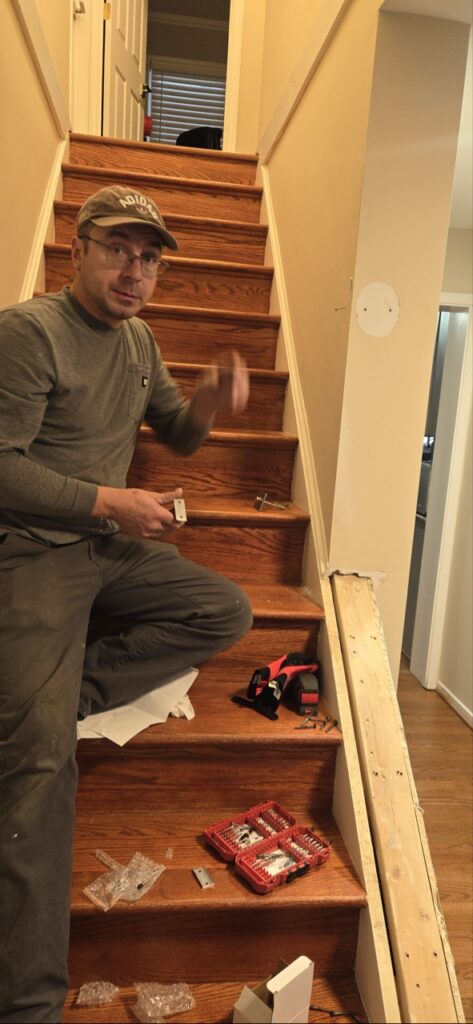 Gallery Perfectum Construction & Plumbing professional completing house remodeling and restoration project on wooden staircase in Gaithersburg, MD.