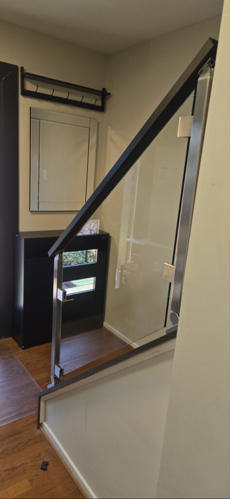 Gallery Modern staircase railing and glass panel installation by Perfectum Construction & Plumbing.