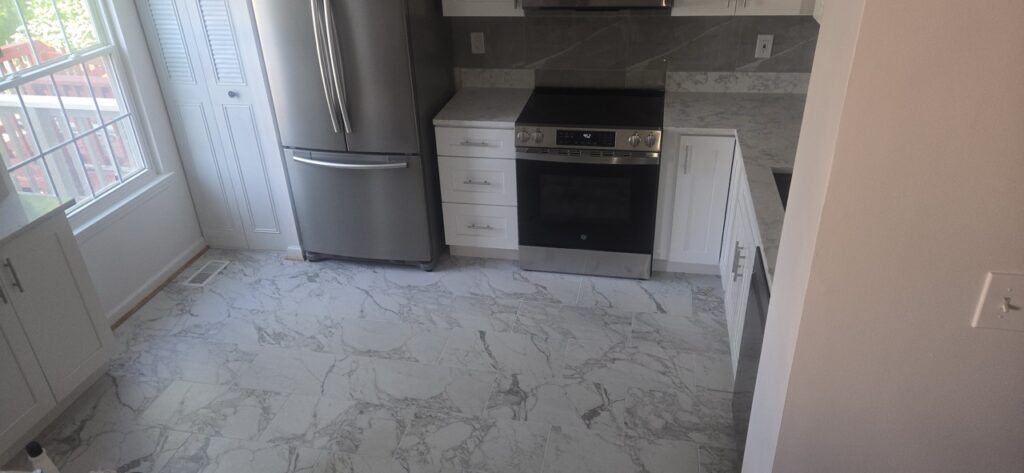 Gallery Completed kitchen remodel with new appliances and tile flooring in Gaithersburg, MD.