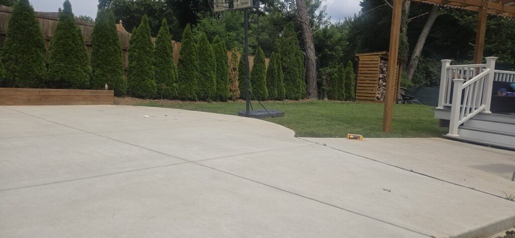 Gallery Newly poured concrete patio and walkway by Perfectum Construction & Plumbing.