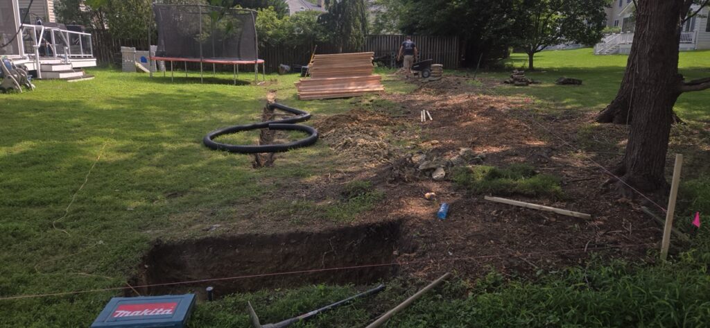 Gallery Gaithersburg, MD house remodeling project: plumbing installation and excavation in backyard.
