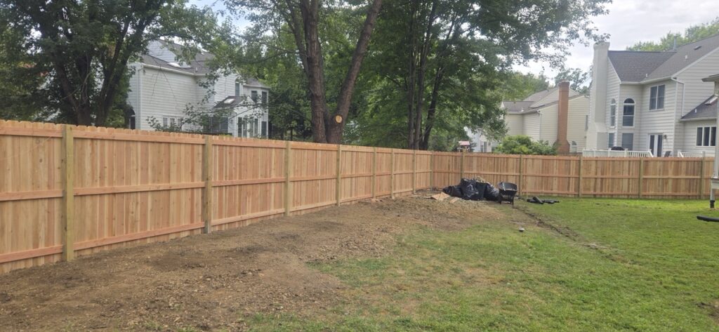 Gallery Newly installed wooden fence and landscaping in Gaithersburg, MD, showcasing Perfectum Construction & Plumbing remodeling project.