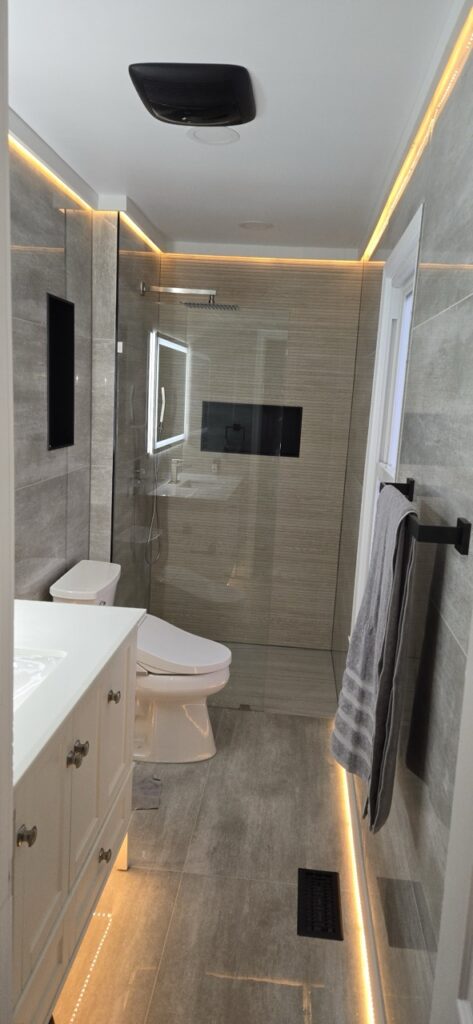 Gallery Modern bathroom remodel with tiled shower and lighting by Perfectum Construction & Plumbing