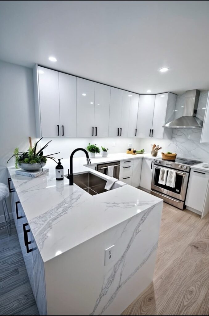 Gallery Modern kitchen remodel with white cabinetry and marble countertops by Perfectum Construction & Plumbing.